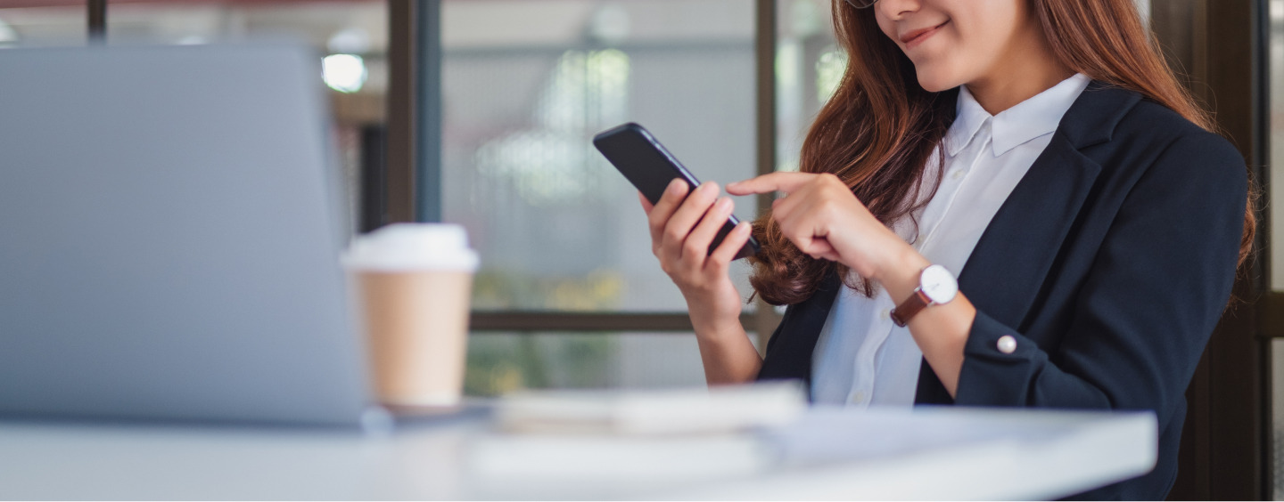 Women Holding a Phone in Hand